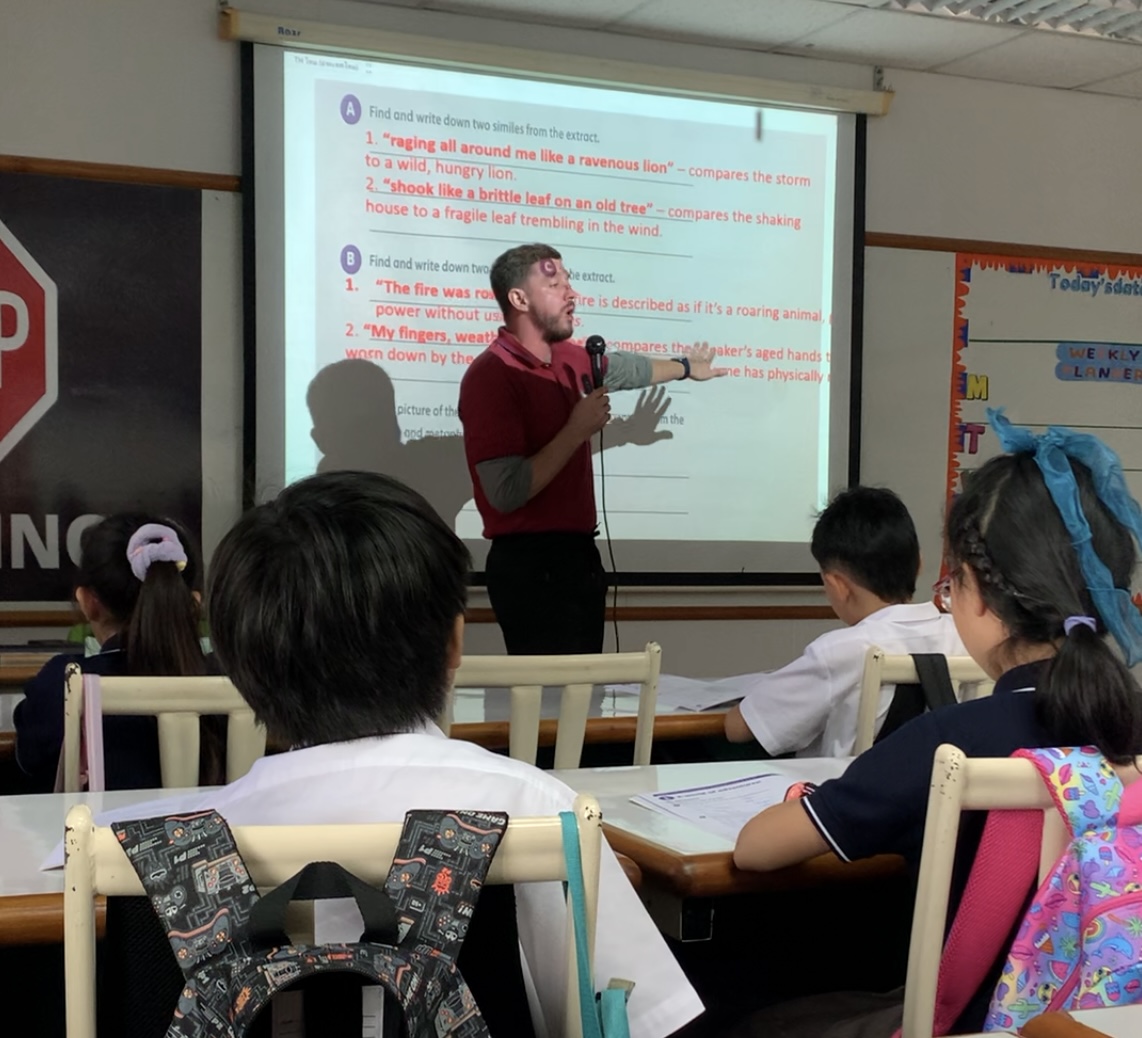 Native English teacher delivering English lesson to primary students at Ek Burapa School — top O-NET English results EP school Bangkok