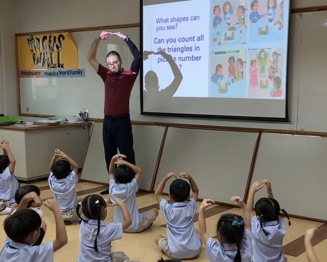 Native English teacher in play-based Kindergarten classroom at Ek Burapa School — Joy of Learning Oxford International Curriculum EP school